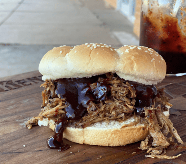 Pulled pork sandwich with barbecue sauce.